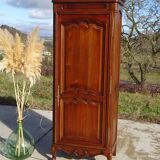 Louis XV style bonnetière in solid cherry wood