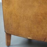 Set of 2 cognac-colored sheepskin club chairs with colorful fabric cushions