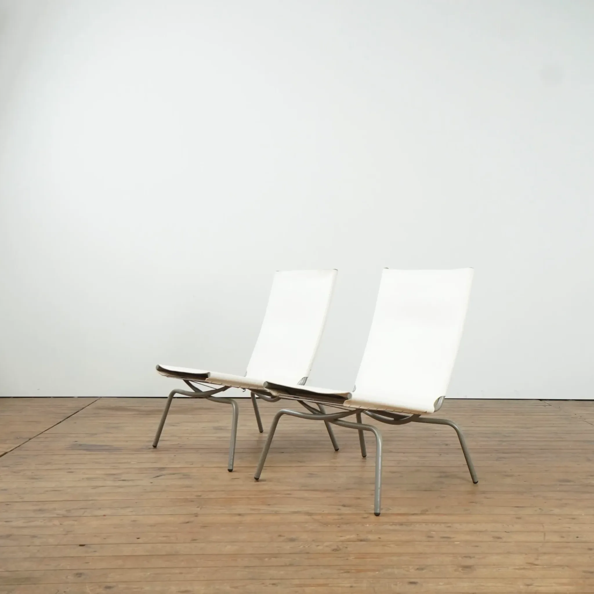 Set of 2 Crossed Legged lounge chairs by Fabiaan van Severen.