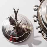 Vintage 1930s silver-plated footed bowl with lid by Warren Rogers New York, featuring a bird motif and ornate details.