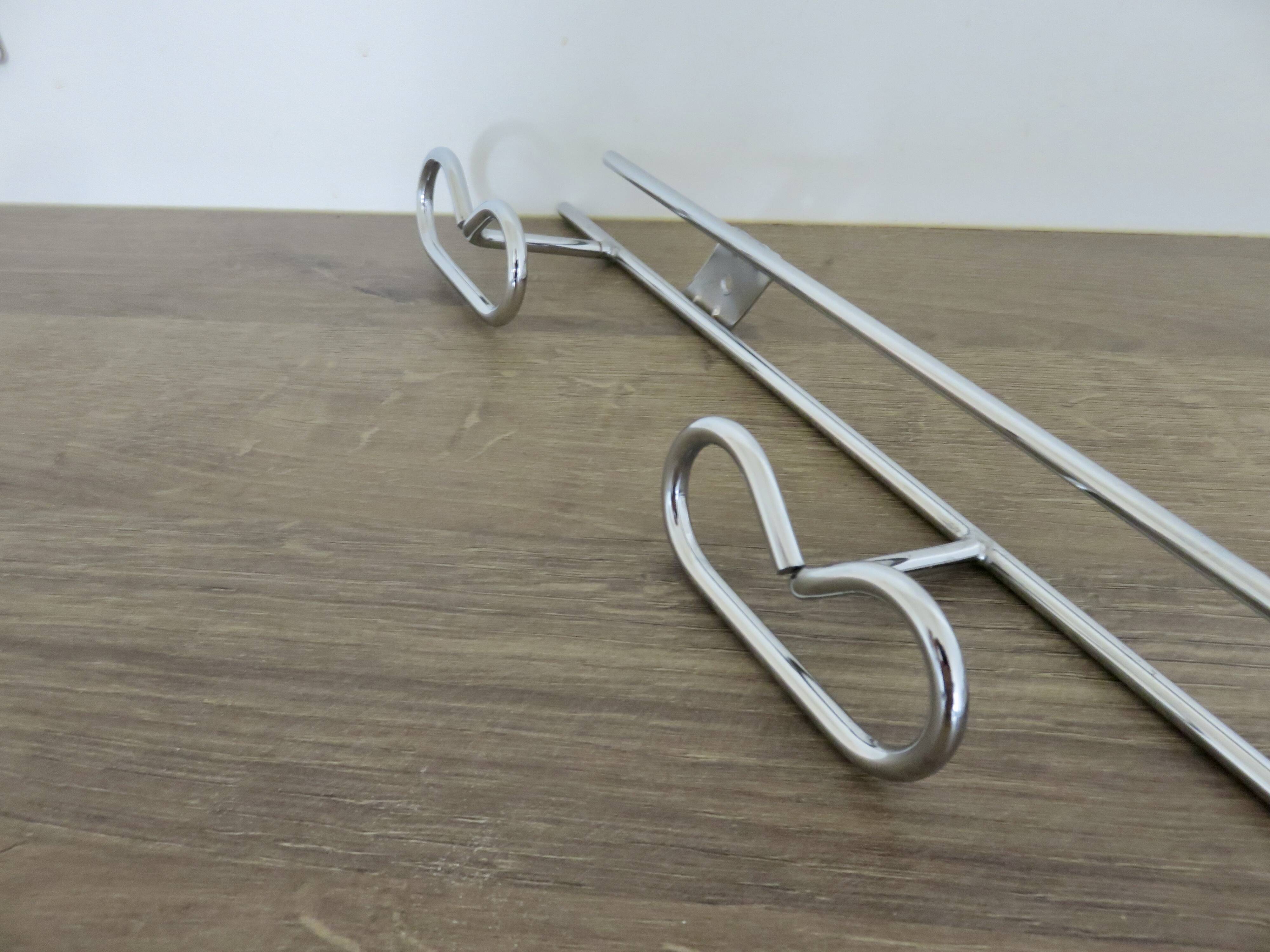 Large vintage wall-mounted coat rack in chrome metal