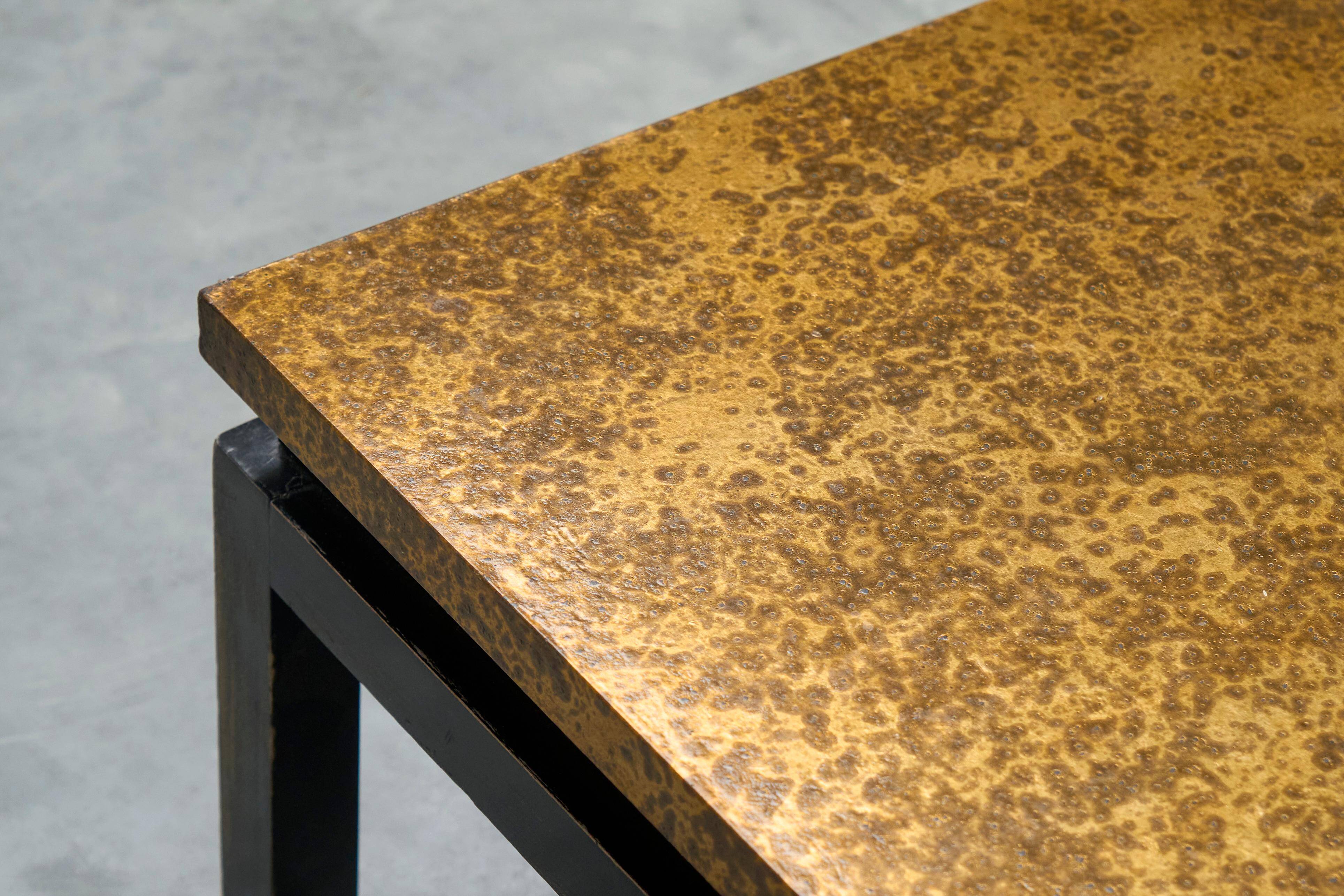 Modernist coffee table with a patinated gold top, 120x52.5x36 cm, mid-20th century.