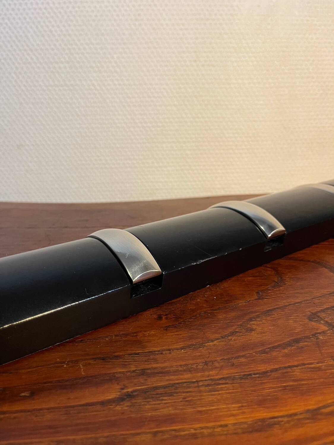 Designer metal and wood wall coat rack