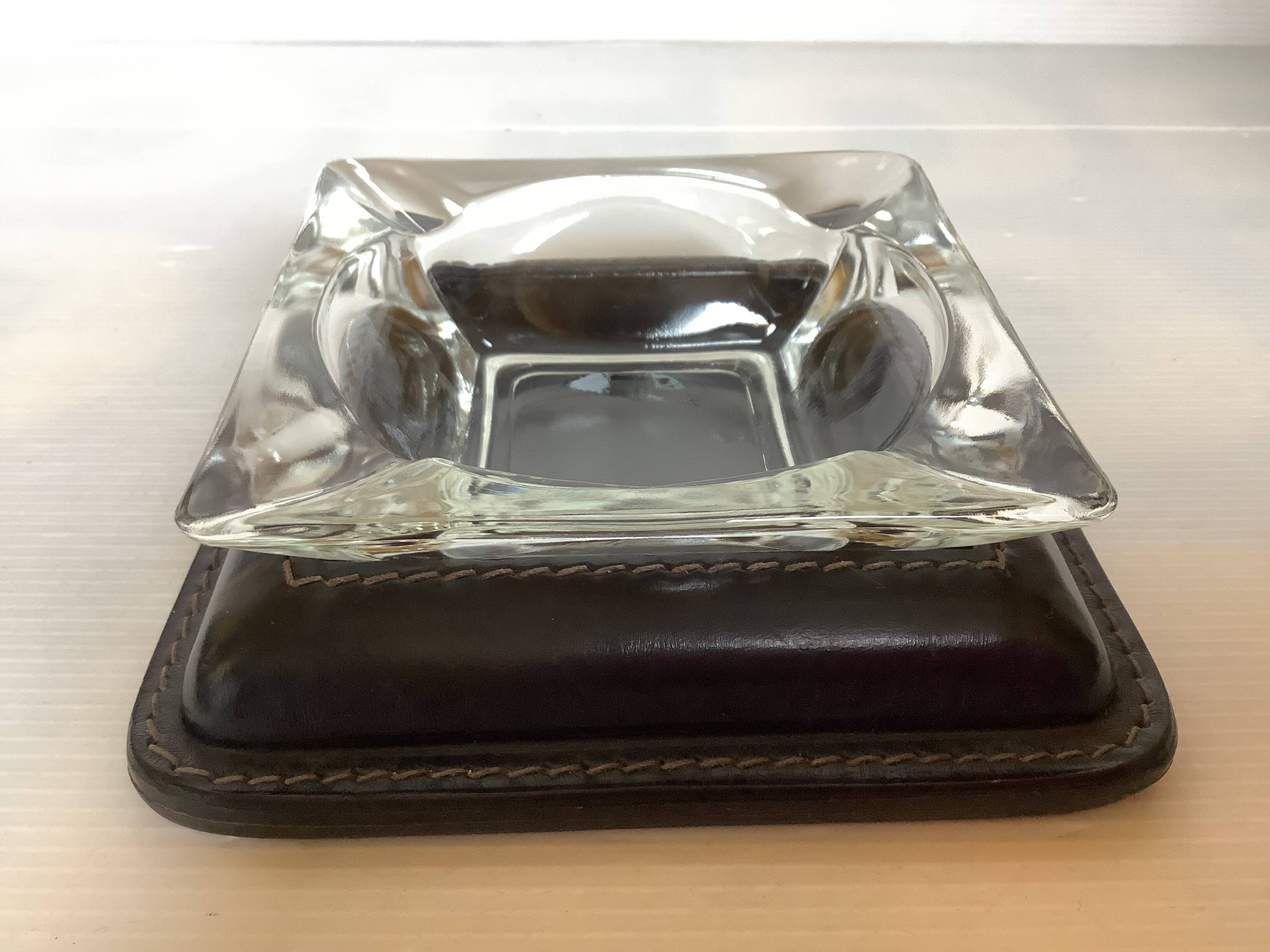 Ashtray, pocket tray, glass and leather.