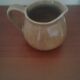 Set of three objects including bottle'milk jar and small stoneware carafon