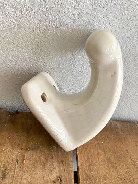 Enamelled earthen coat hook, 1900