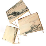 Nested tables in brass and marble.