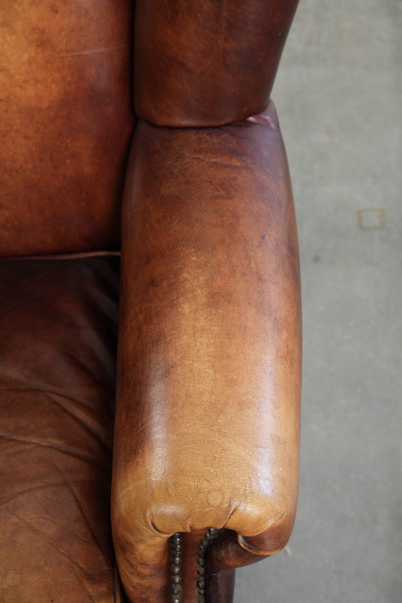 Comfortable cowhide wingback armchair in English style