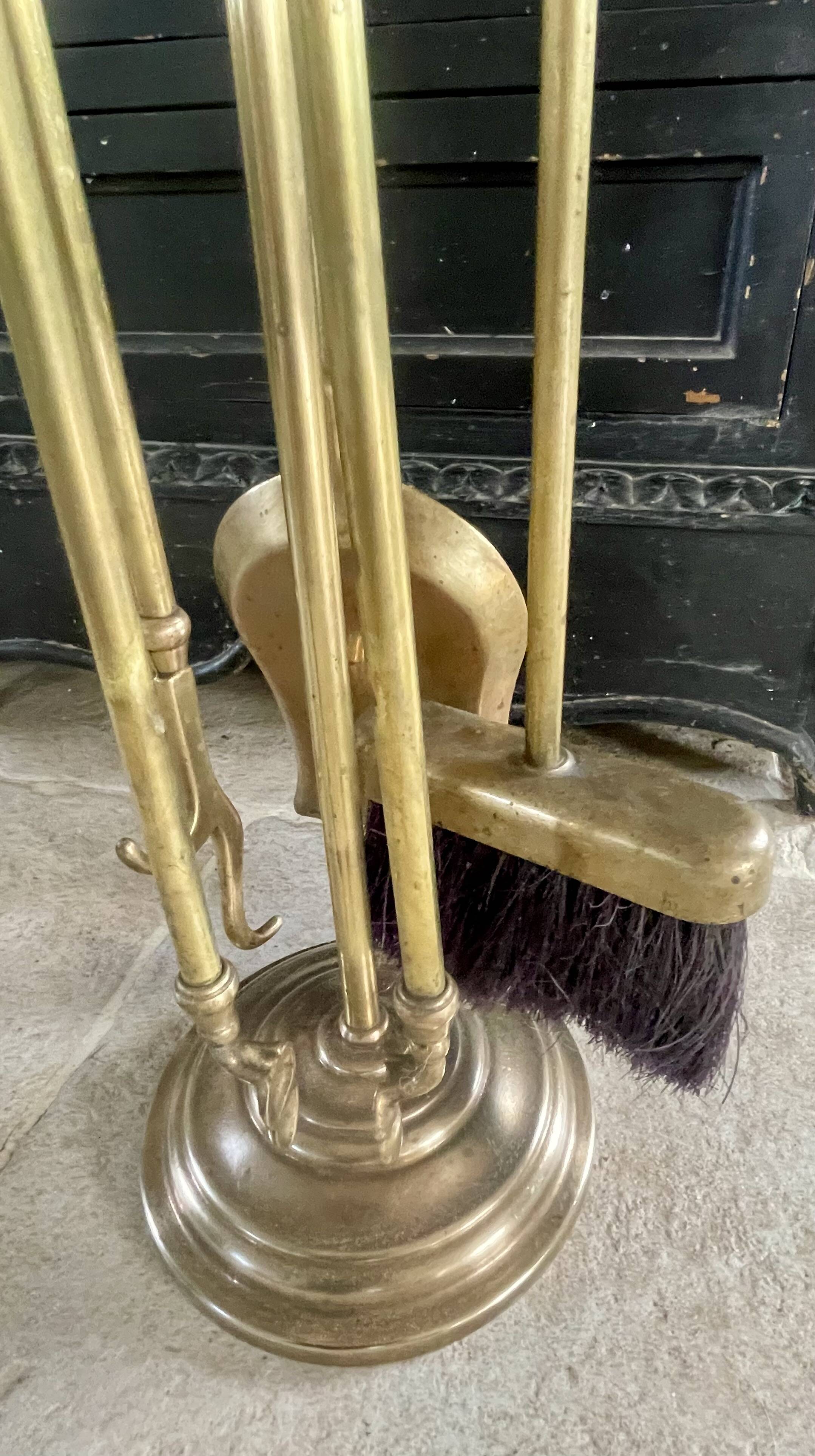 Brass fireplace accessory set with vintage stand