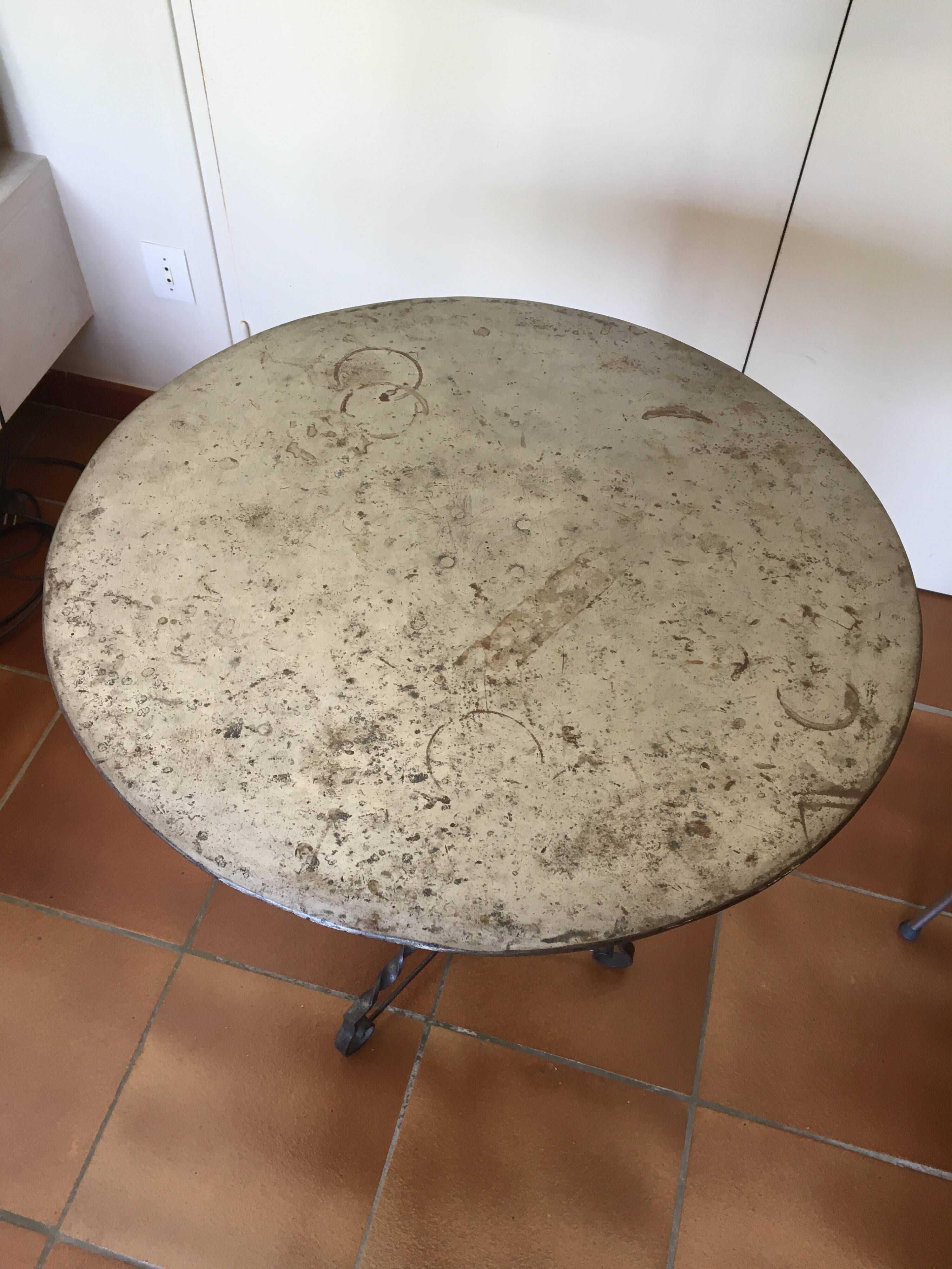 Round and antique metal side table