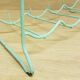 Metal aqua green bottle rack