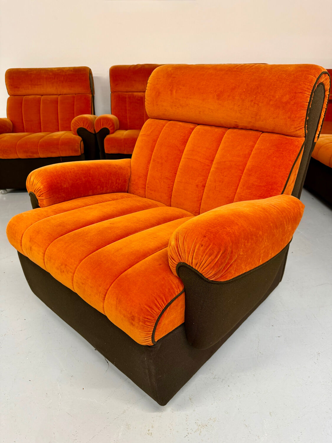 Modular vintage orange corner sofa, 1970s pop design.