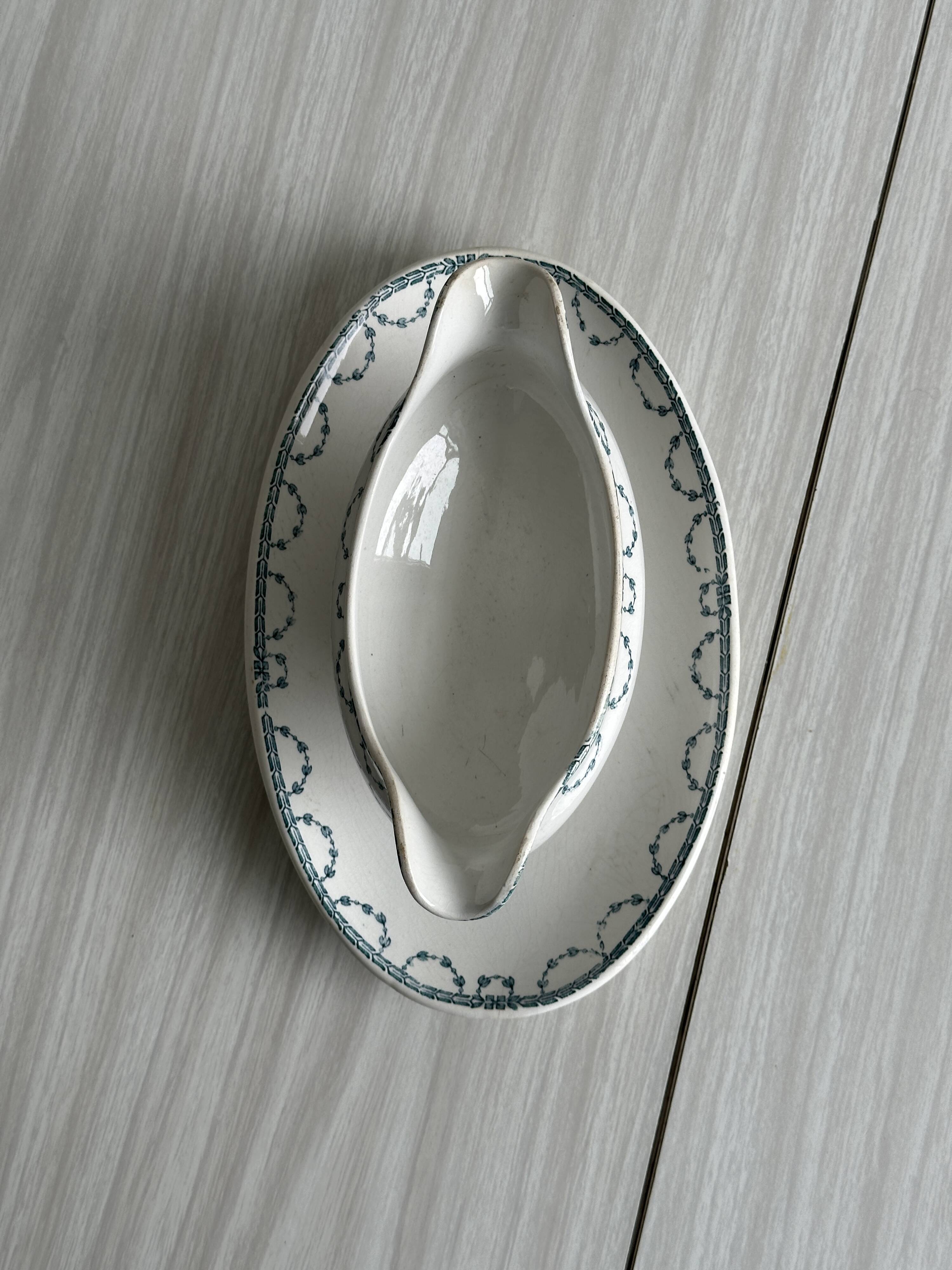 Antique porcelain sauceboat with tray