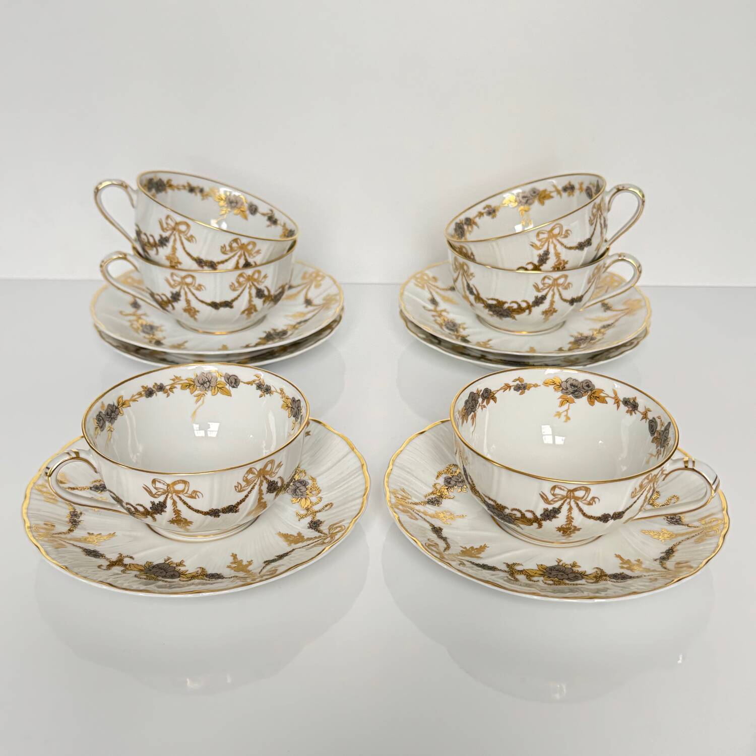 6 Bernardaud teacups and saucers | ribbons/bows and garlands