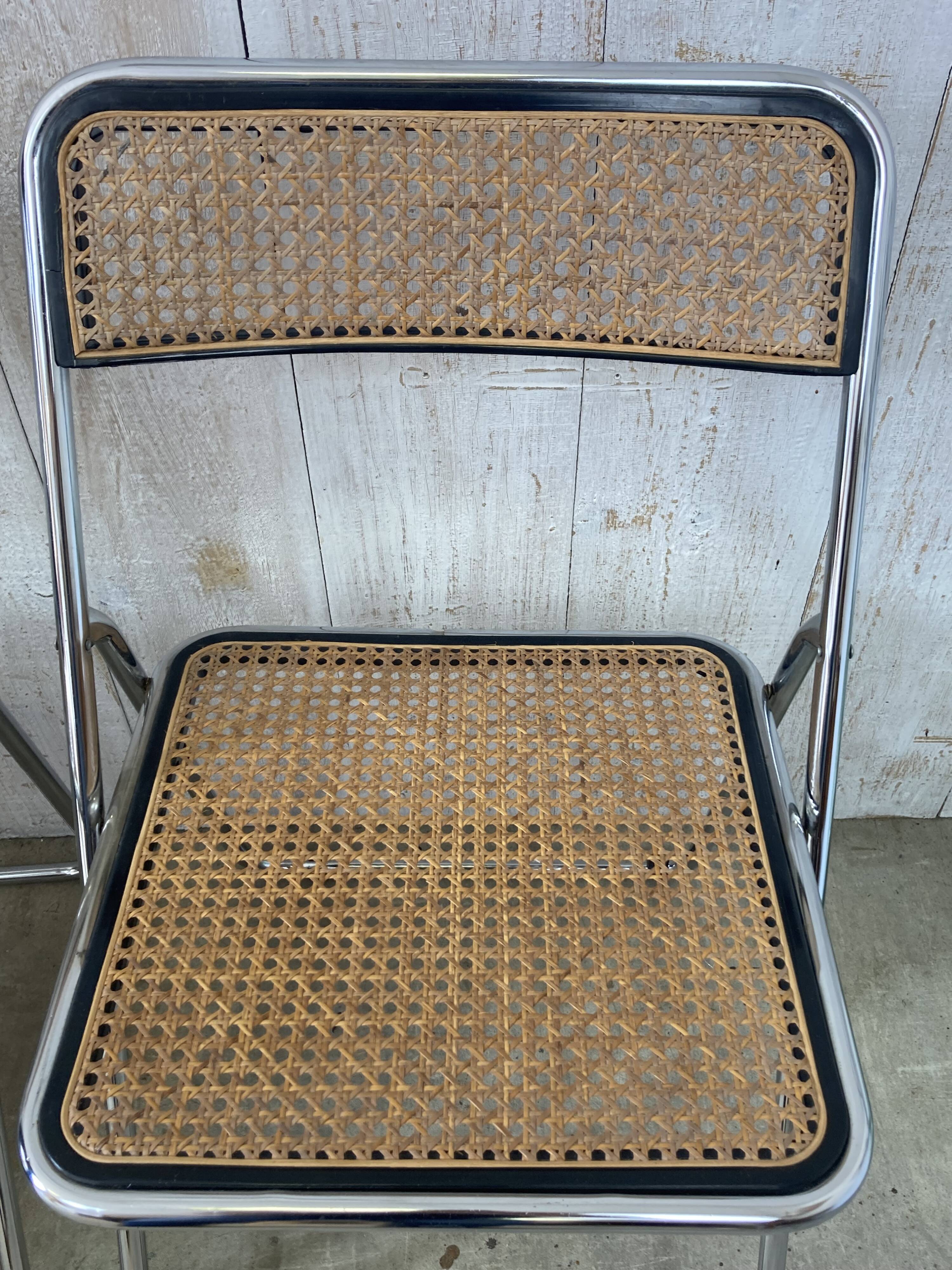 Pair of chrome and cane folding chairs