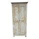 Small antique wardrobe with a faded white patina.