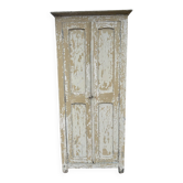 Small antique wardrobe with a faded white patina.