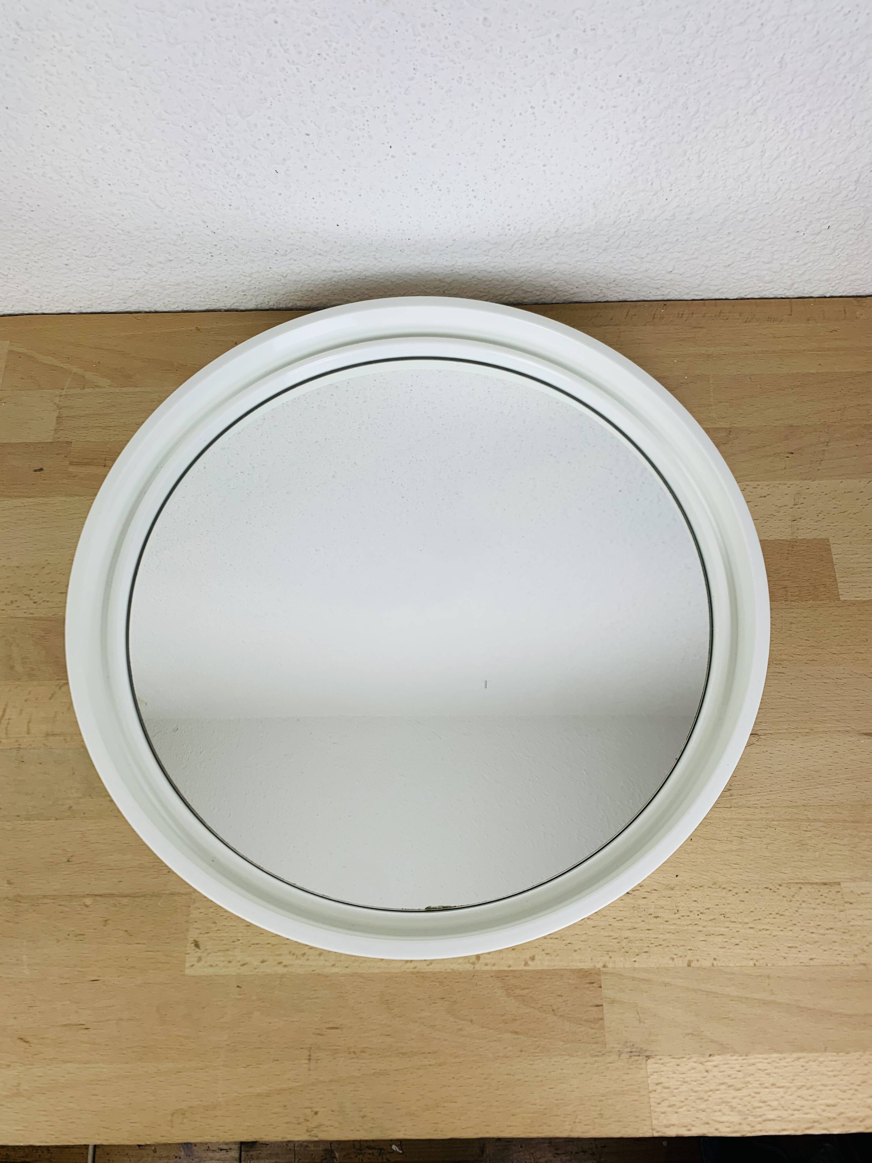 Space age mirror with white frame from the 1970s.