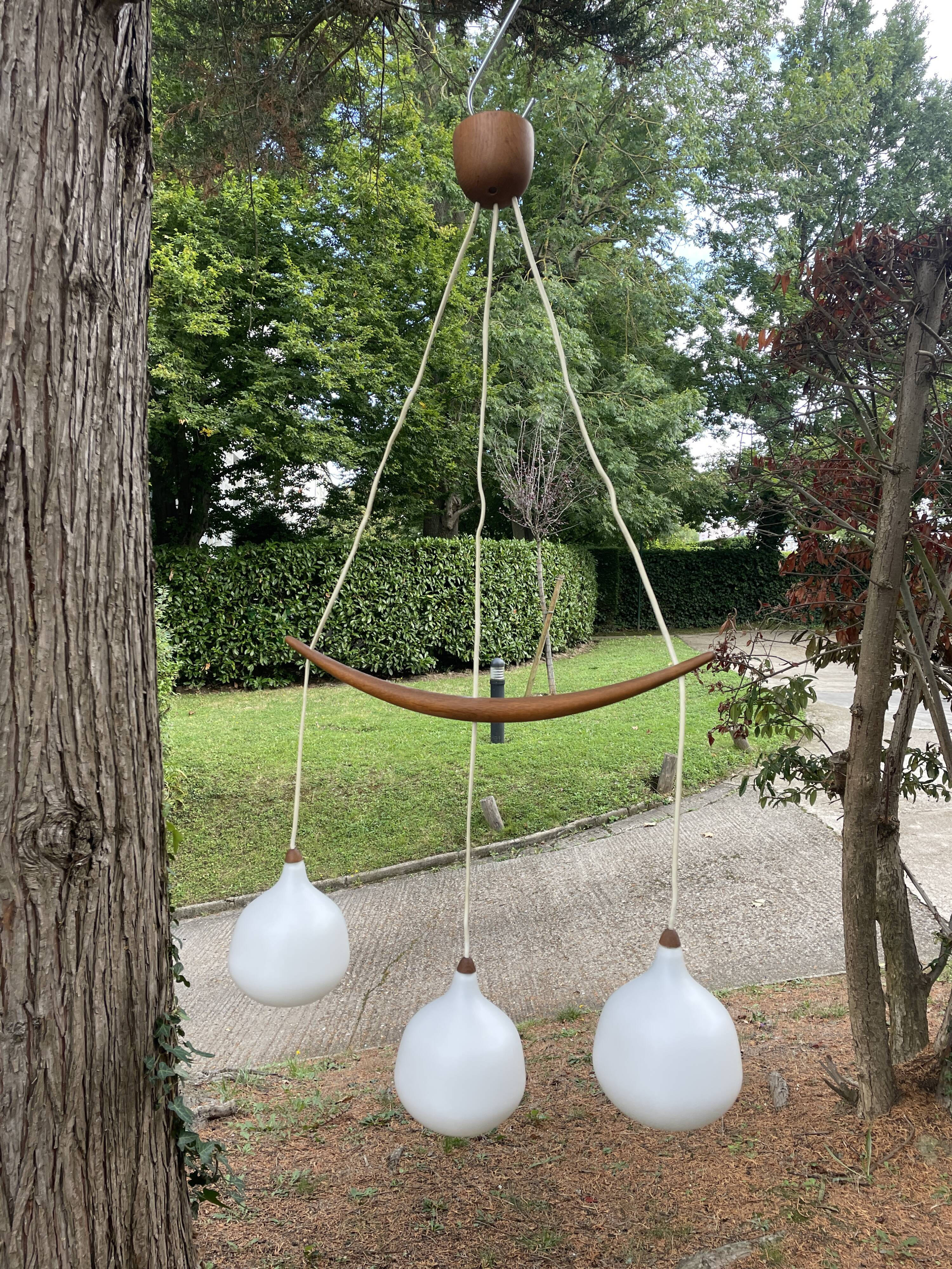 Scandinavian triple pendant light in Opaline and oak by Uno & Östen Kristiansson.
