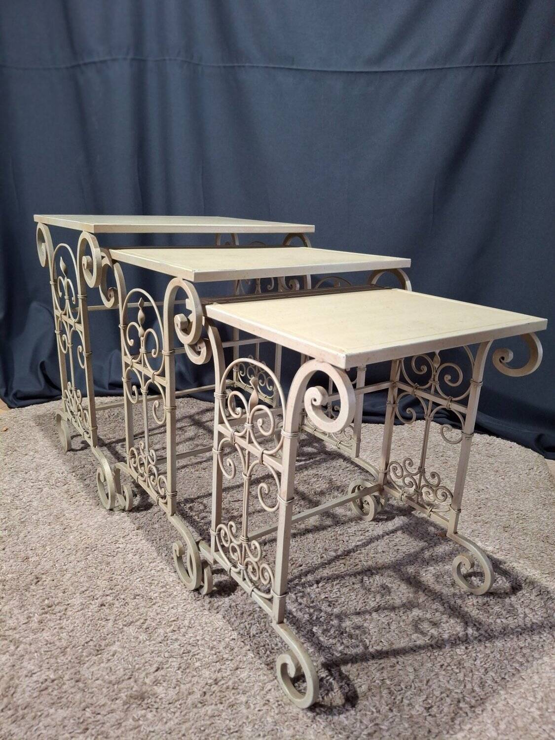 Nesting tables in patinated iron.