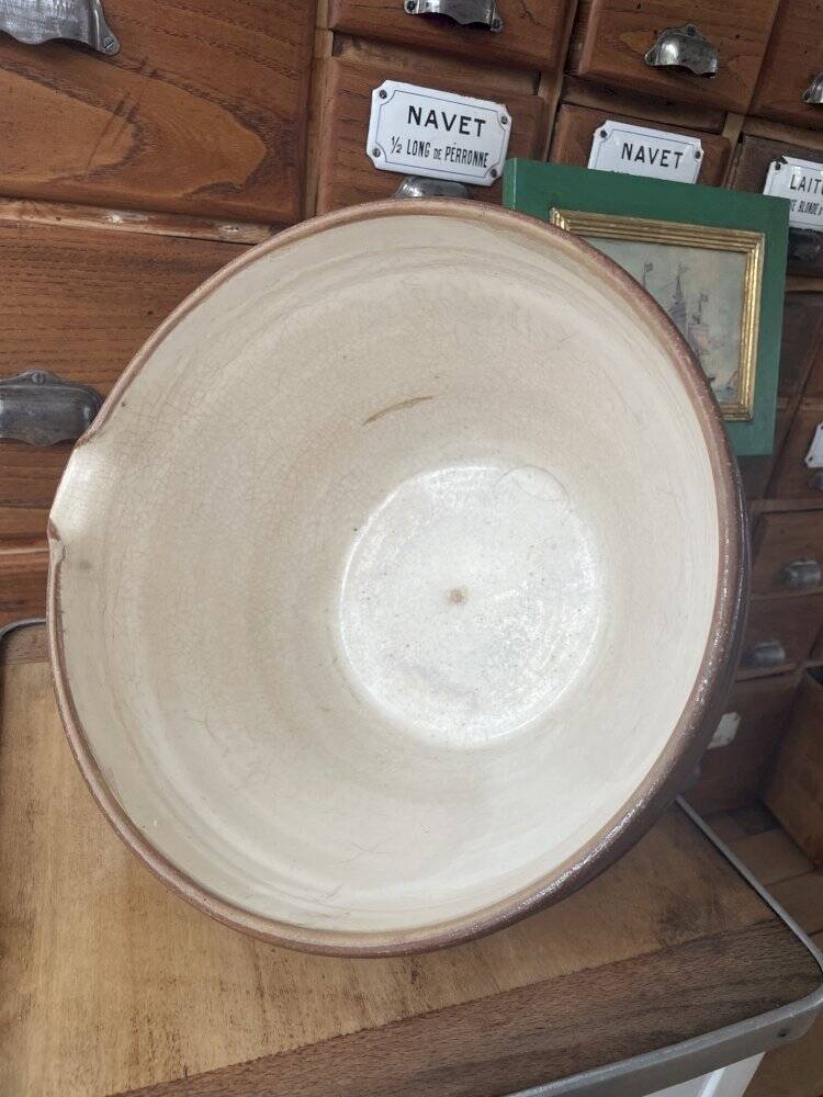 Antique spouted jug in terracotta