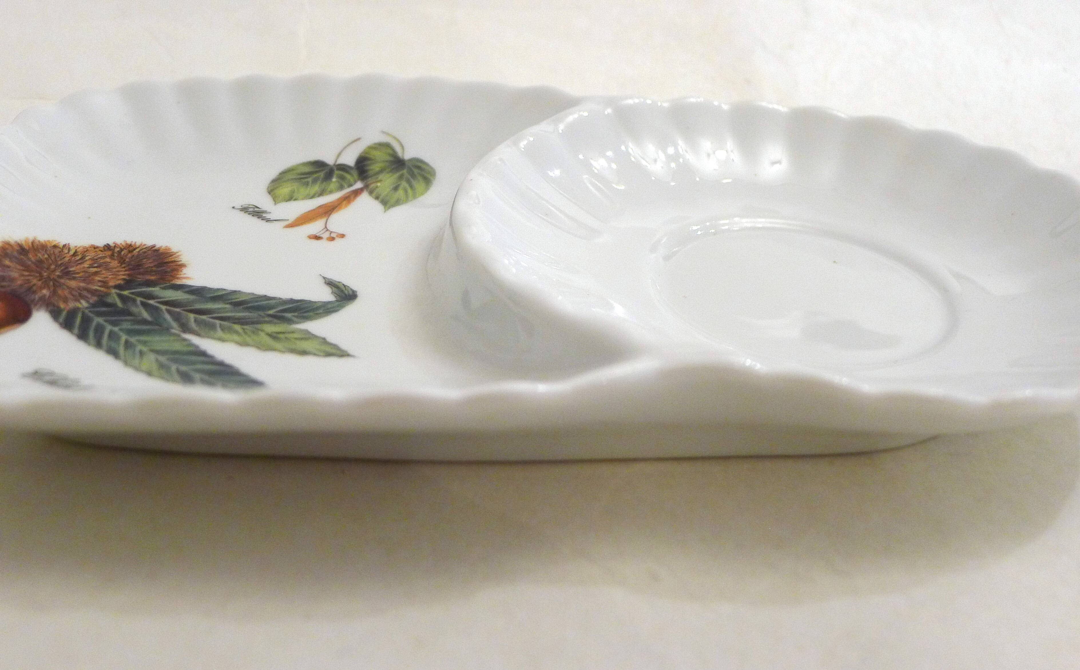 Tea cup, solitary service, naturalistic decoration, in Limoges porcelain.