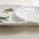 Tea cup, solitary service, naturalistic decoration, in Limoges porcelain.