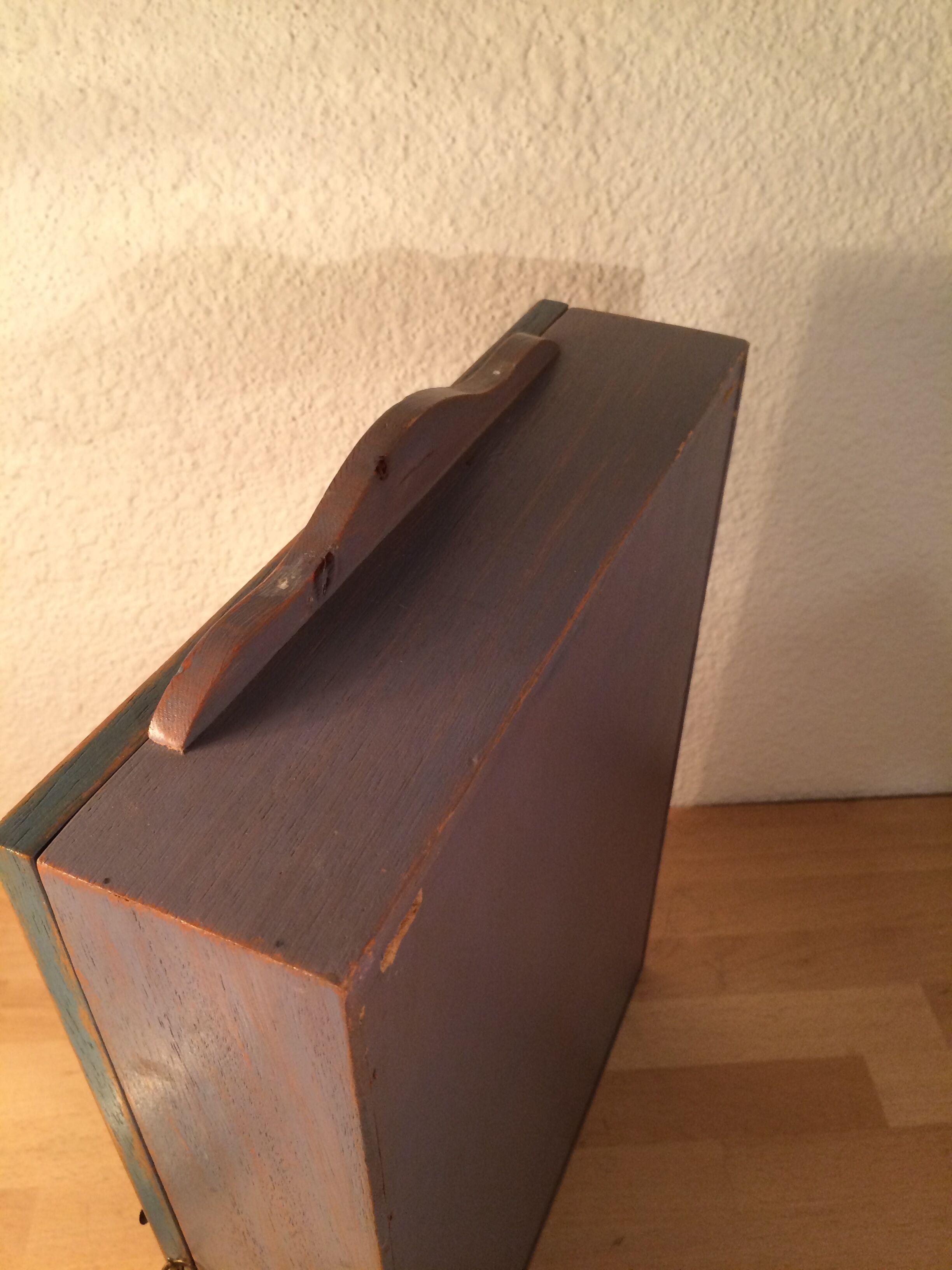 Display shelf with miniature blue wood and mirrors