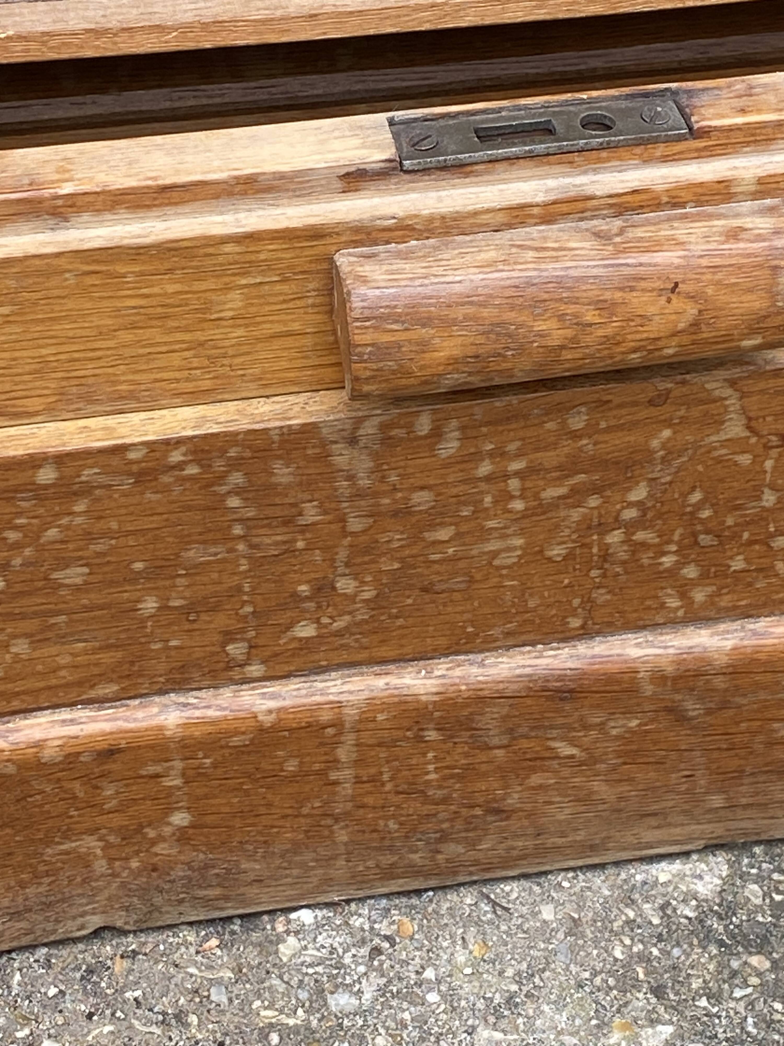 Double-column oak filing cabinet with curtains, 1950s.