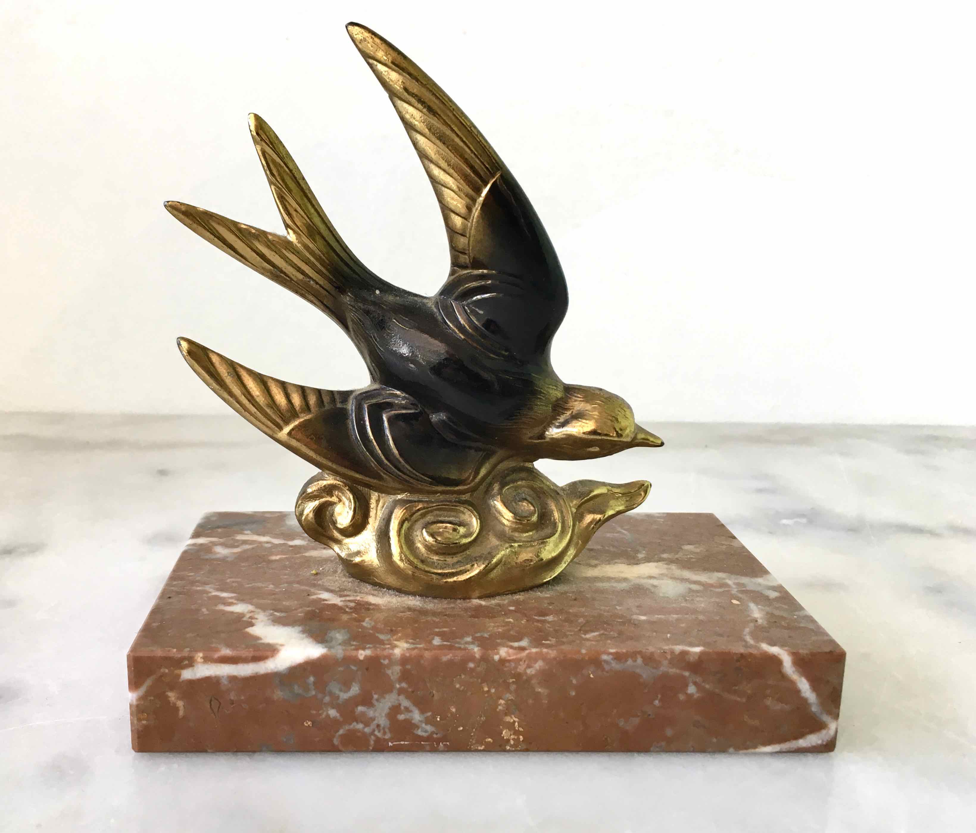 Marble swallow and brass paperweight