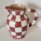 Old ceramic pitcher pattern checkerboard tiles