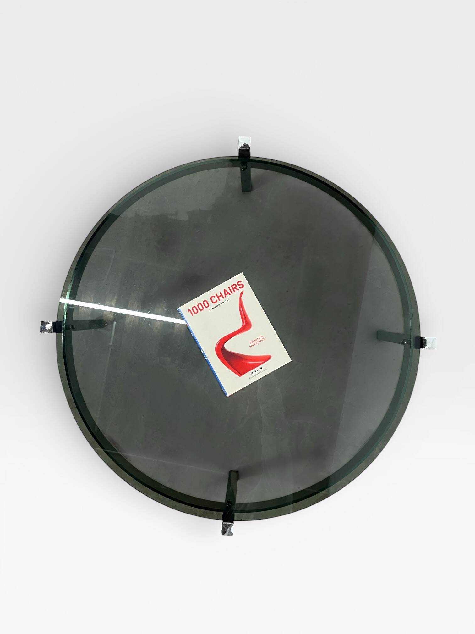 Vintage round coffee table with smoked glass and chrome.