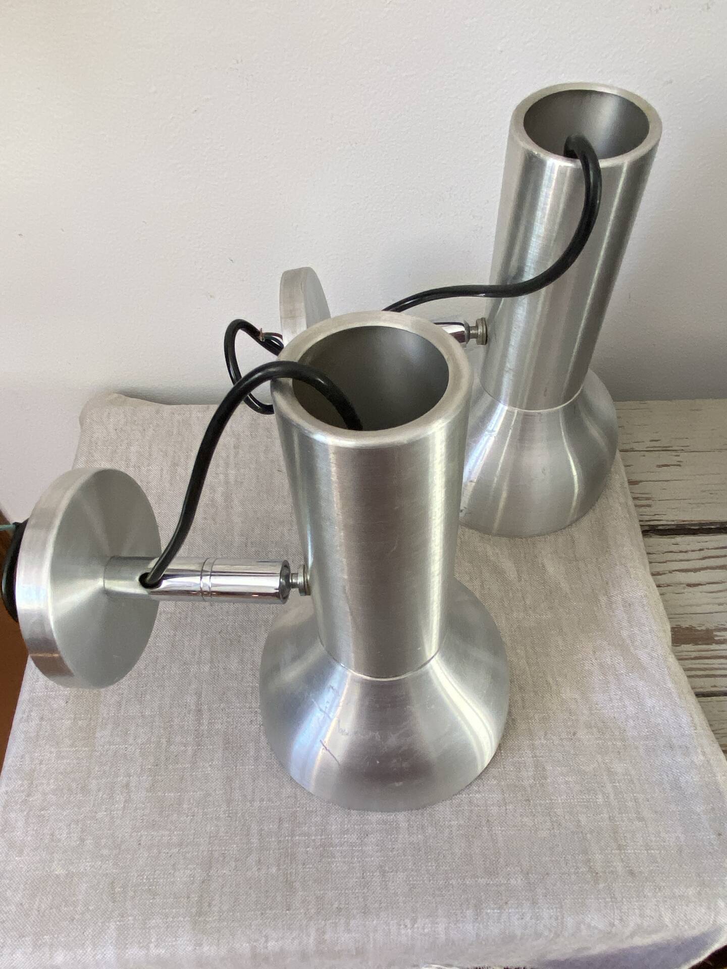 Pair of brushed metal wall sconces
