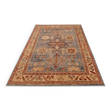 Beige, blue, red oriental rug.