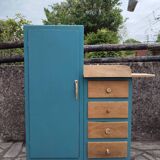Asymmetrical changing table cabinet