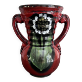 Red vase with floral decoration