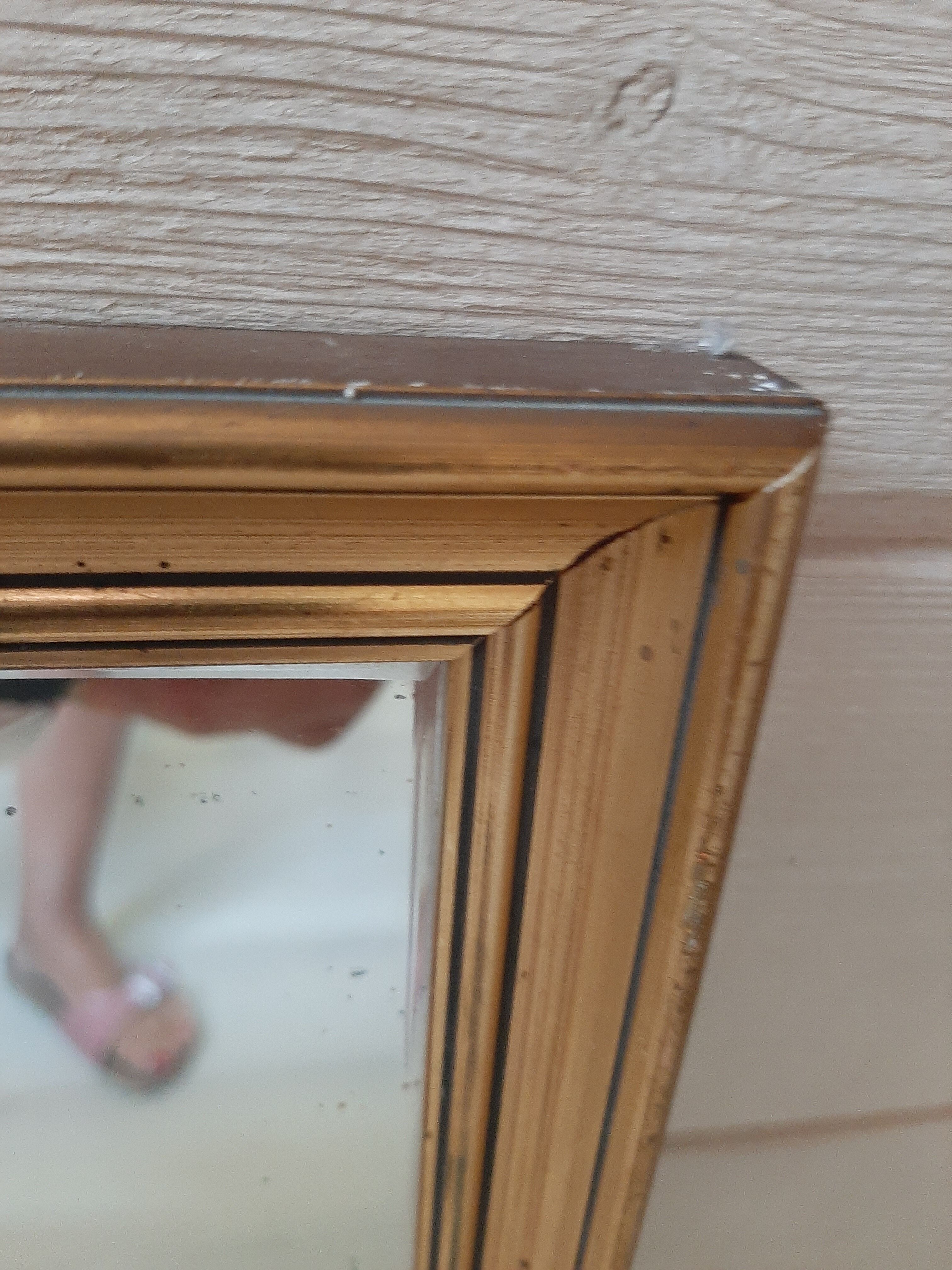 Golden framed mirror