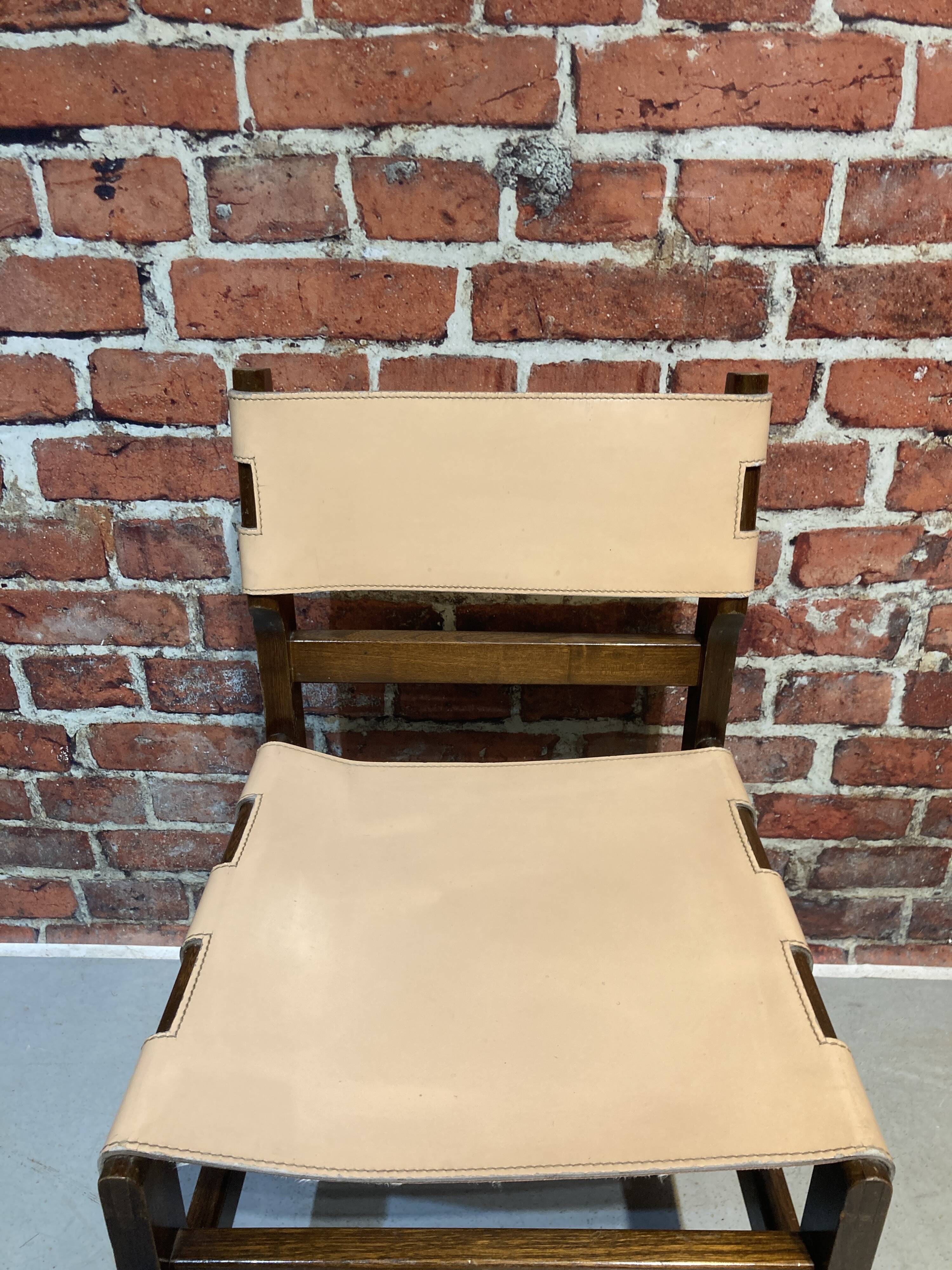 Set of four wooden and leather chairs from Maison Regain