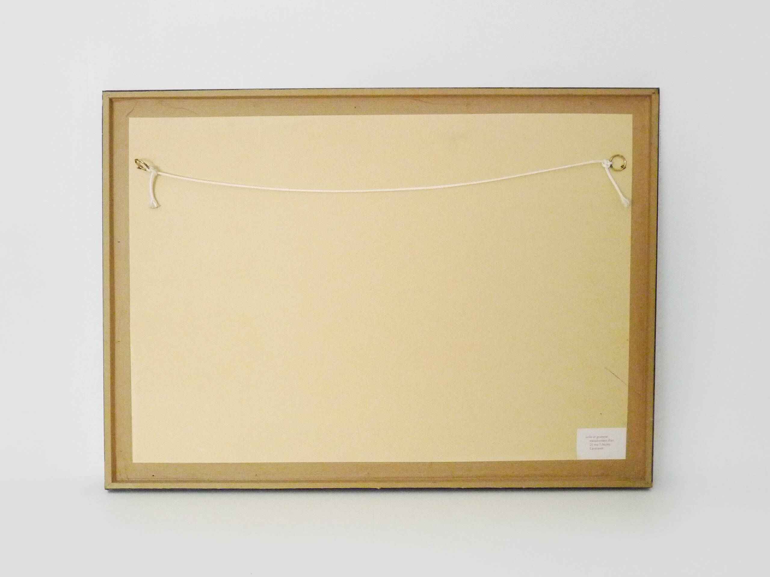 Framed painting with gray flower decor.