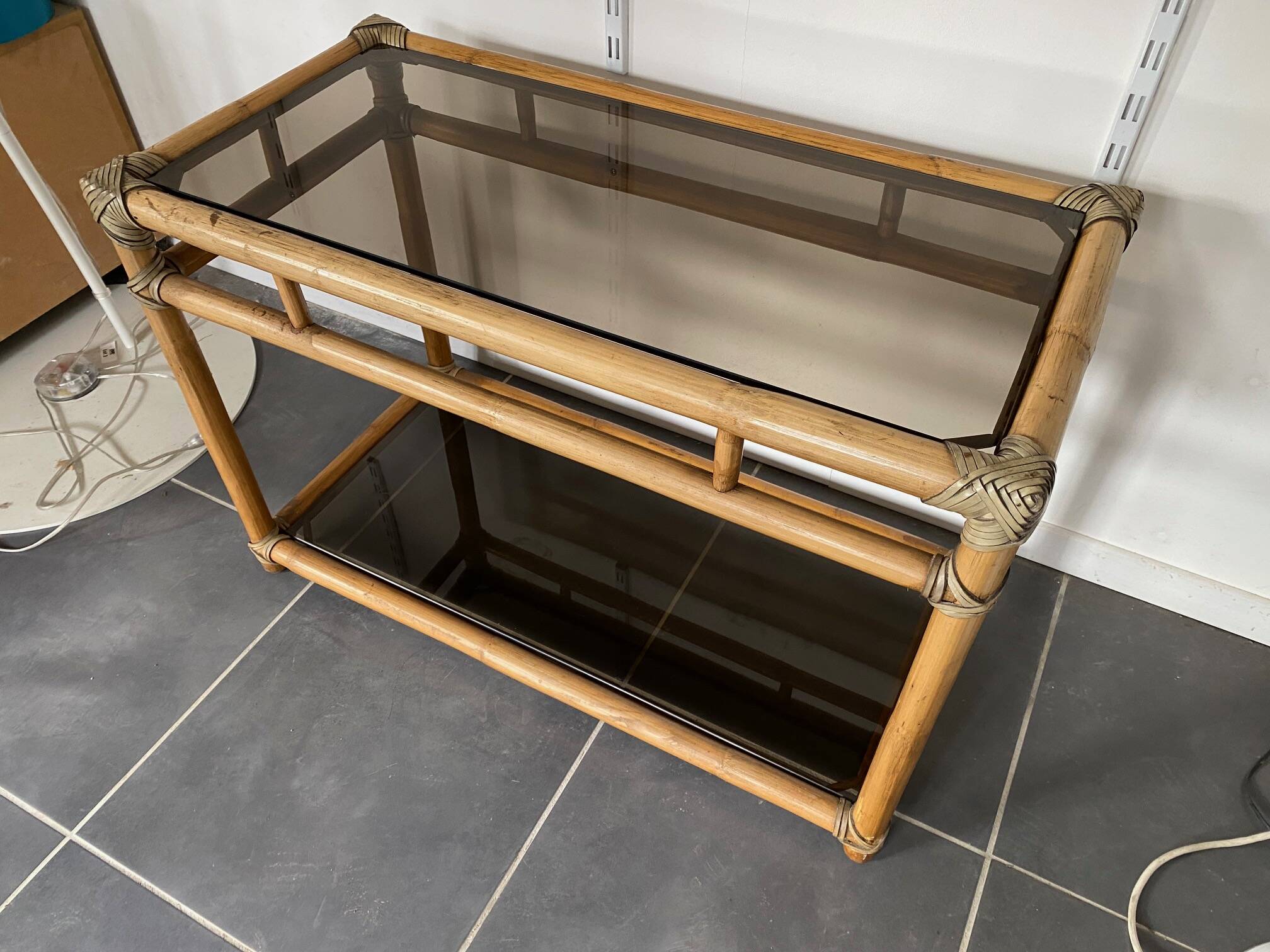 Vintage 1950s rattan and glass TV storage unit.