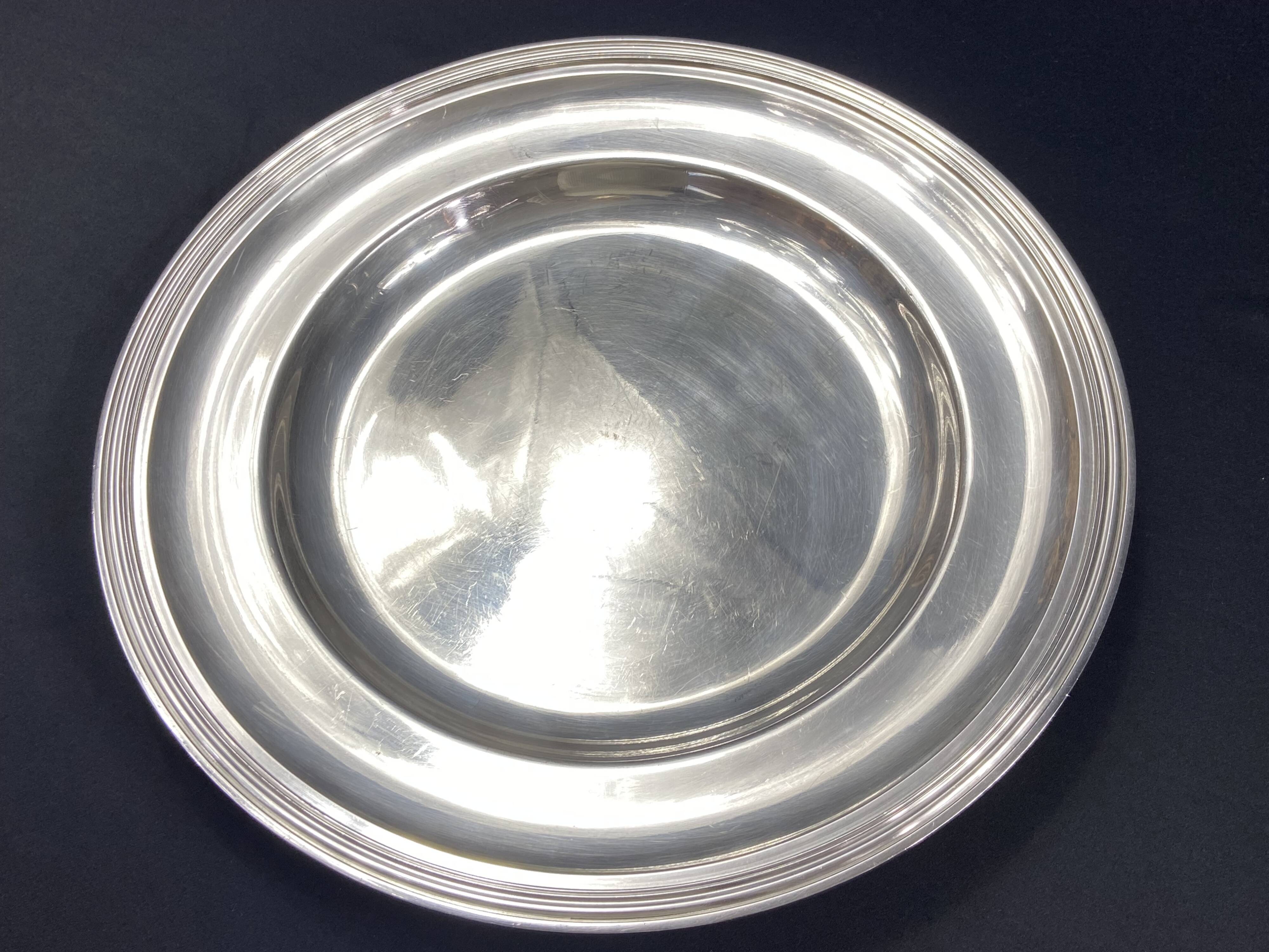 Circular silver-plated metal dish signed ercuis