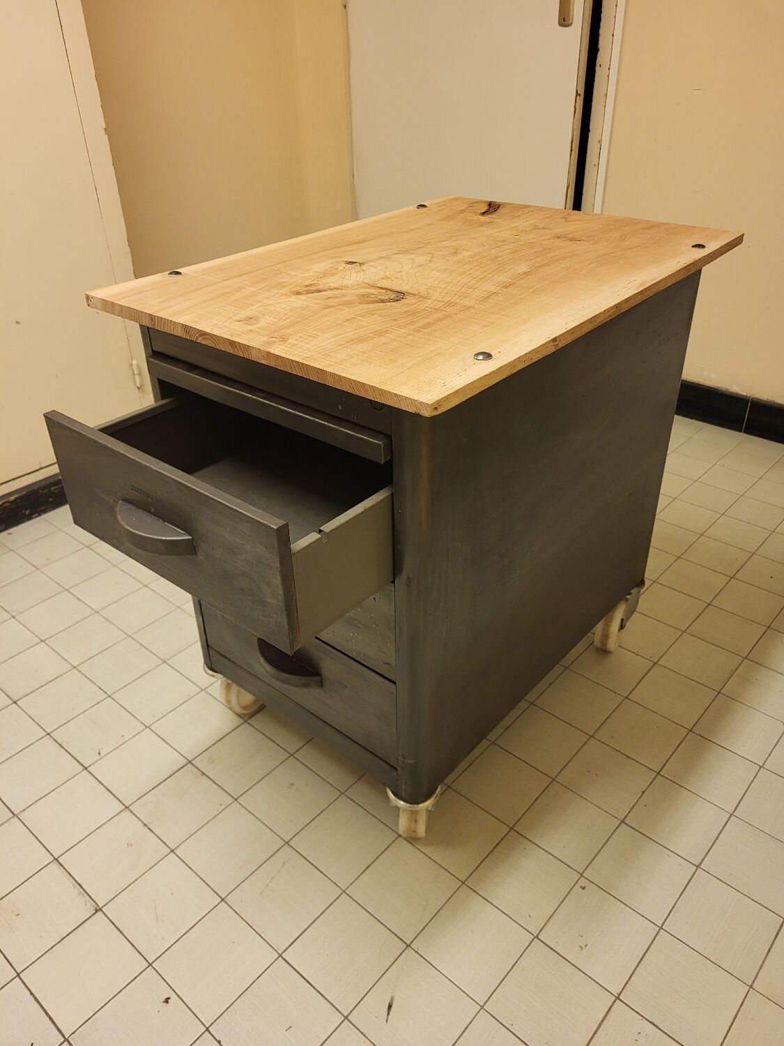 Wood and waxed metal furniture on casters