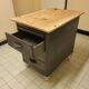 Wood and waxed metal furniture on casters