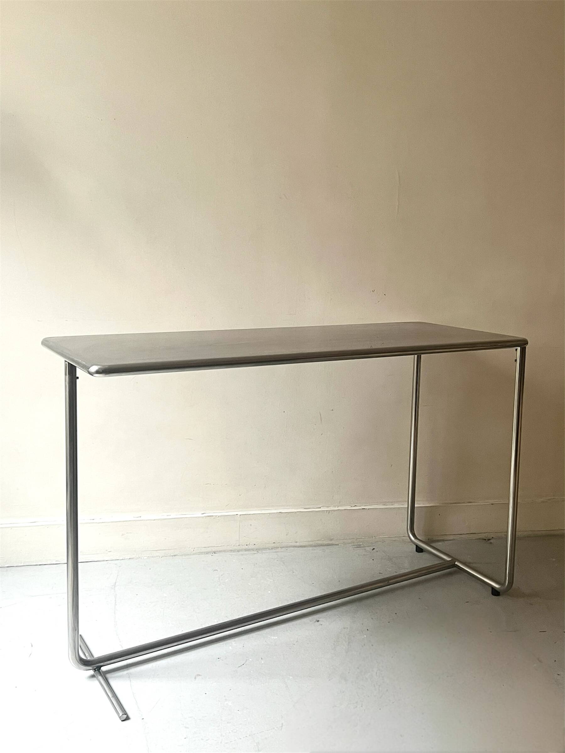 Dining table / tubular and modernist desk in chrome metal
