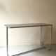 Dining table / tubular and modernist desk in chrome metal