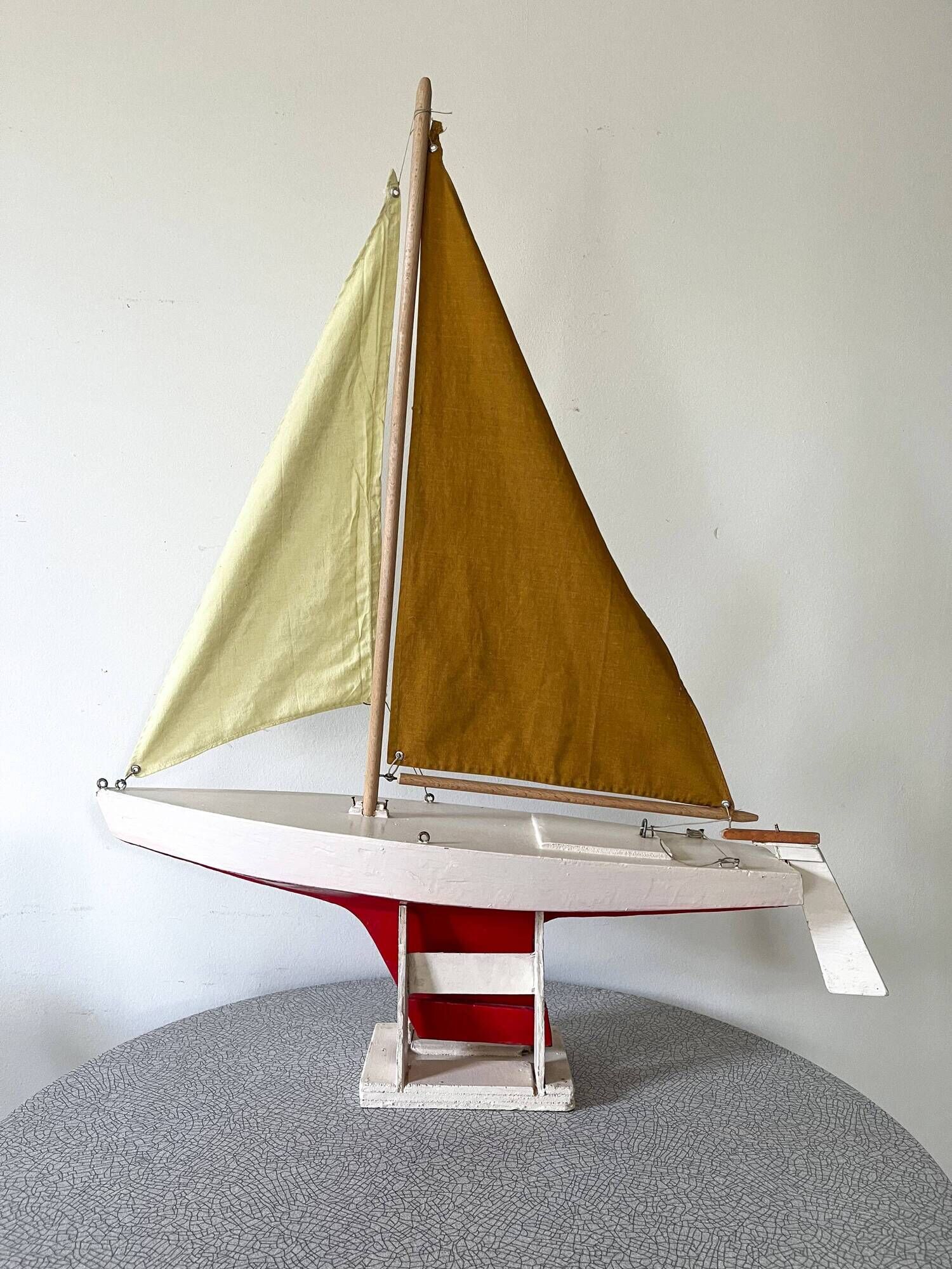 Navigable wooden sailing ship with pretty vintage colors