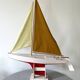 Navigable wooden sailing ship with pretty vintage colors