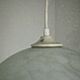 French suspended ceiling light in the shape of a white ball, Clichy 3336 glass shade.