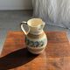 Beige carafe with stylized blue flower friezes