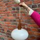 Suspension opaline et teck Louis Kalff